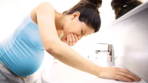 pregnant woman vomiting