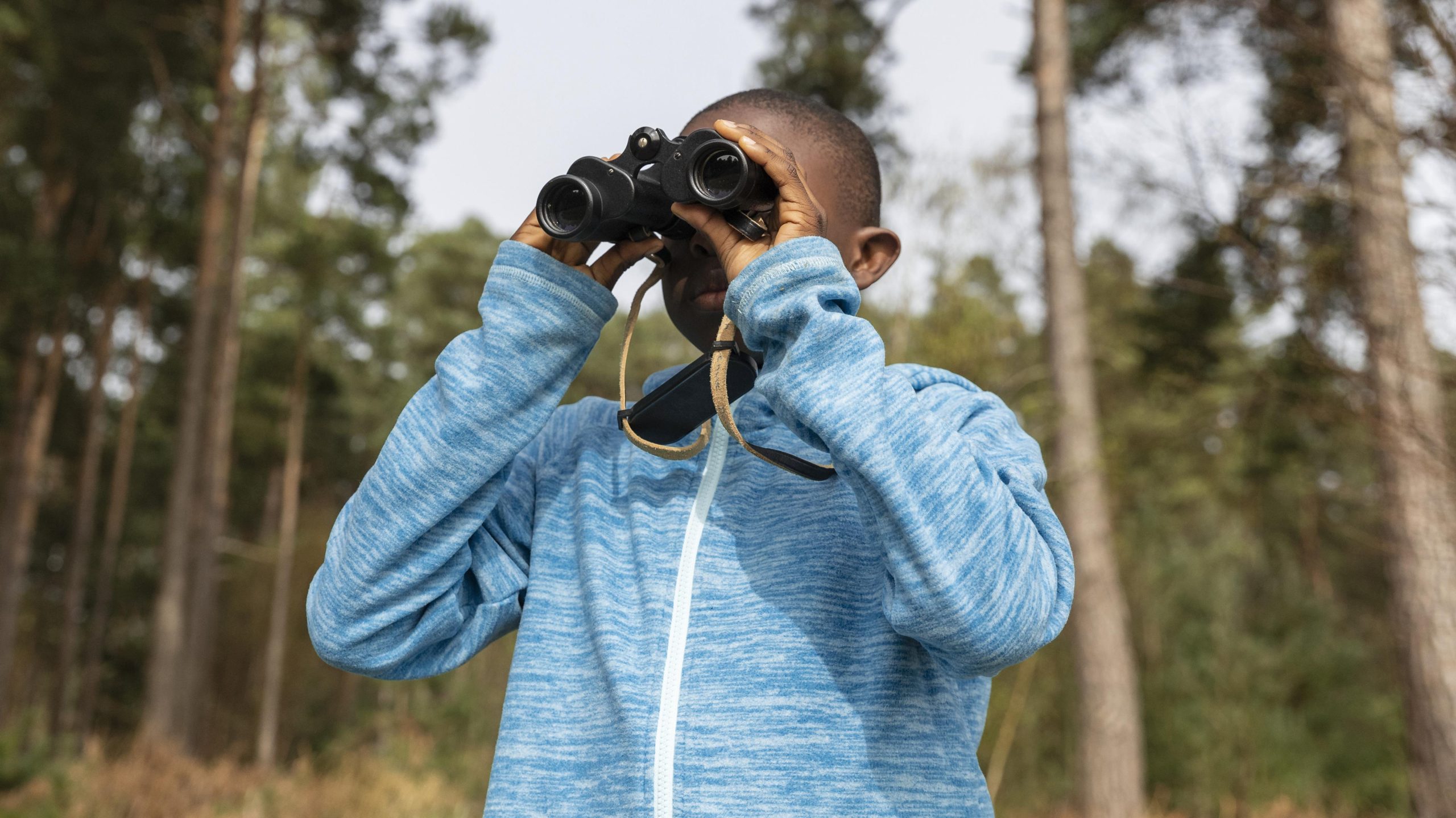 Man watching from binoculars